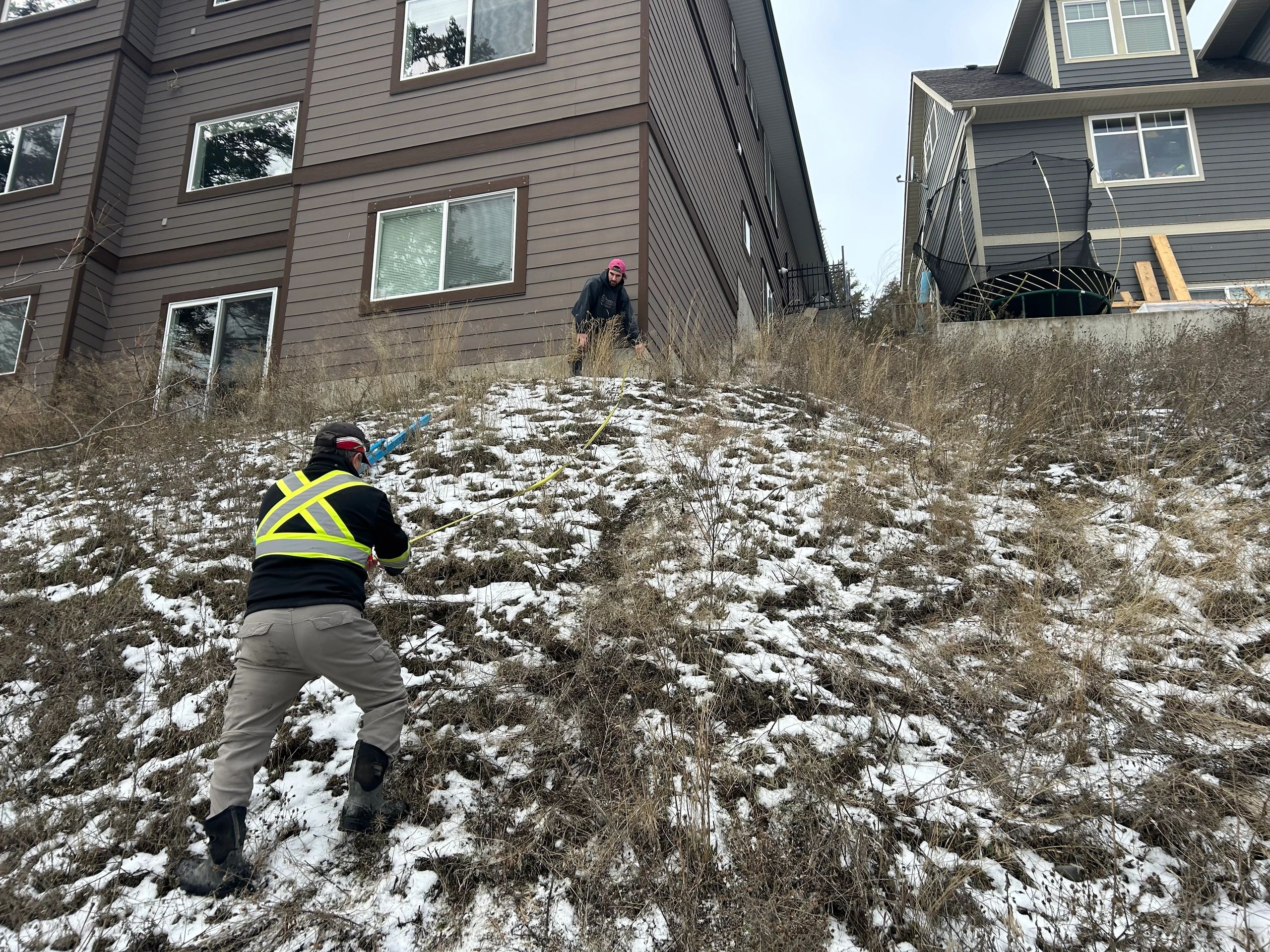 Field work for the design of a lock-block retaining wall system.